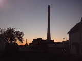 Large old factory at dusk